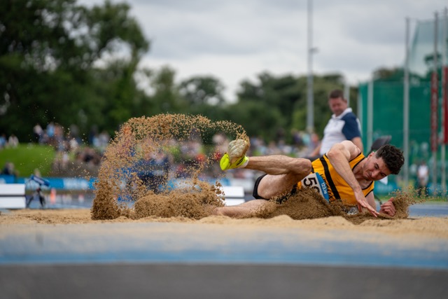 Long jumper suspended mid-air